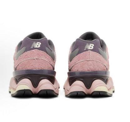 New Balance 9060 rear view sneaker in lavender and pink with black heel clip.