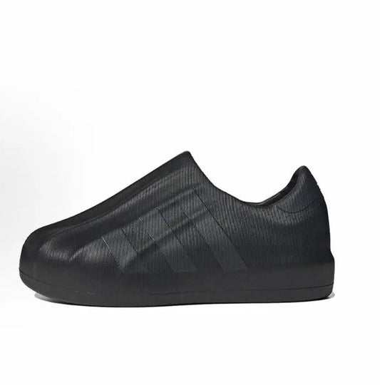 Black Adidas Adifom slip-on with textured knit upper and thick rubber sole