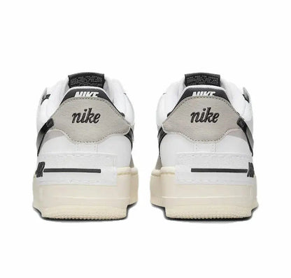 Nike low-top sneakers, rear view with Nike branding on off-white heel