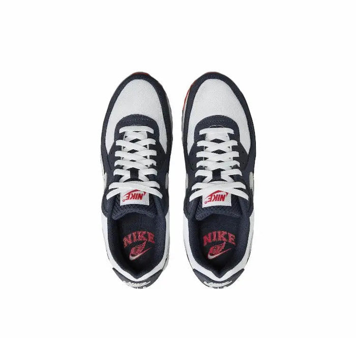 Nike Air Max 90 sneakers with navy-and-white uppers, white laces, tongue and side logos