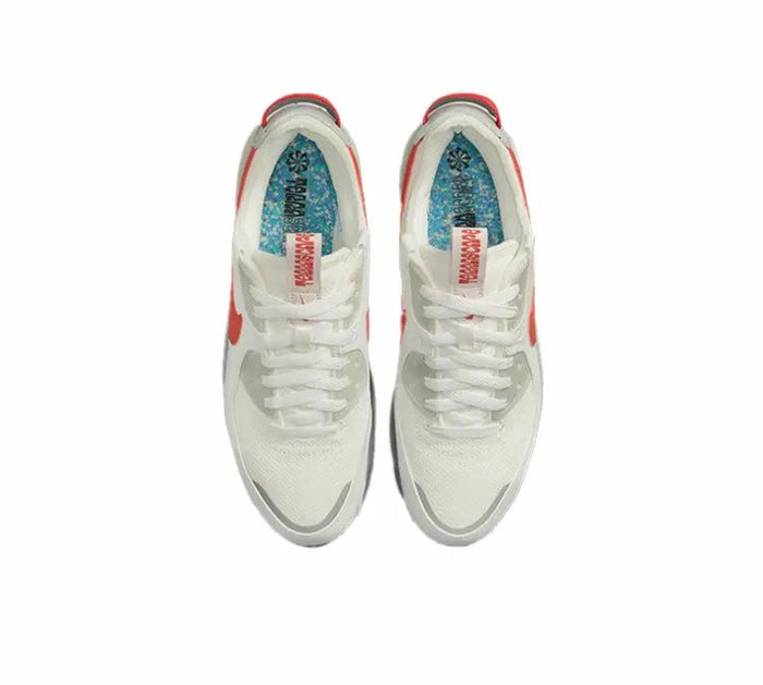 Nike Air Max 90 top view, white upper with red heel tab and lace-up collar