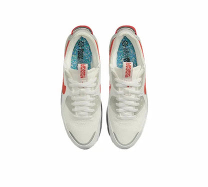 Nike Air Max 90 top view, white upper with red heel tab and lace-up collar