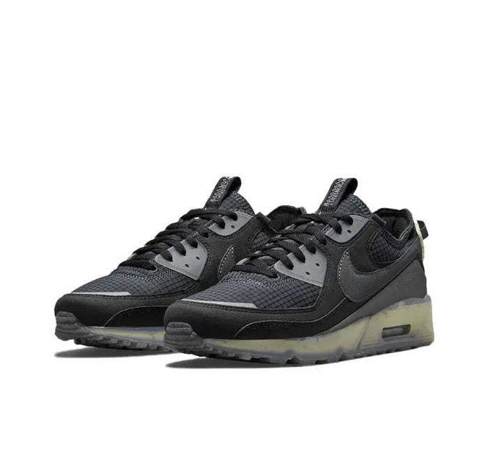 Nike Air Max 90 sneaker pair, dark grey/black uppers with lime-accented sole