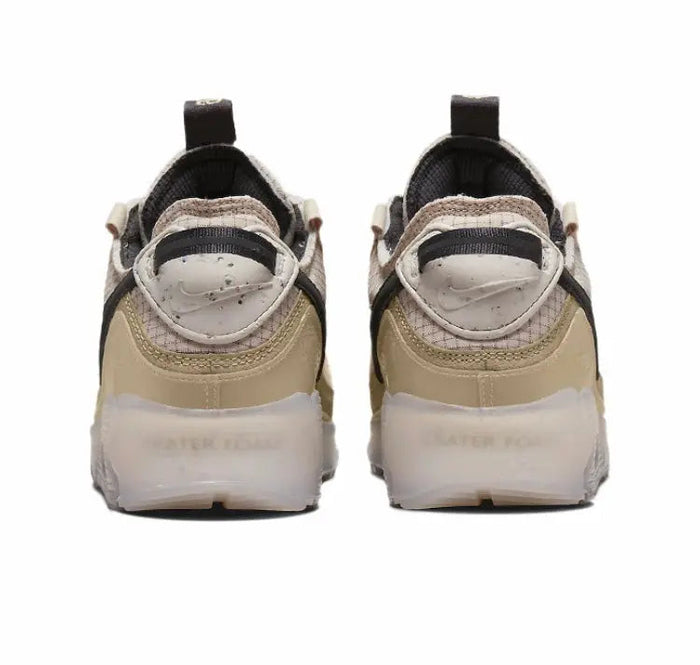 Nike Air Max 90 sneakers back view with black heel tabs and beige cushioning