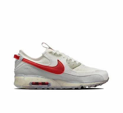 Nike Air Max 90 side view, white sneaker with red Swoosh and visible Air unit