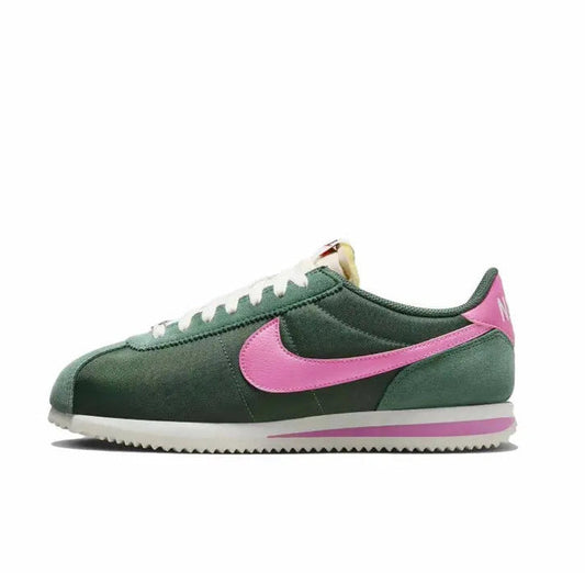 Nike Cortez sneakers in dark green with pink swoosh and white laces
