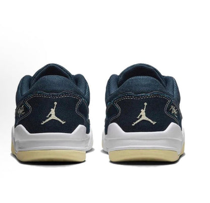 Navy low-top sneakers with heel branding and white midsole