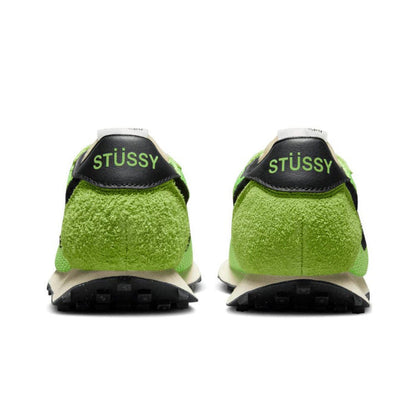 Pair of green knit sneakers with STUSSY heel patch and black outsole