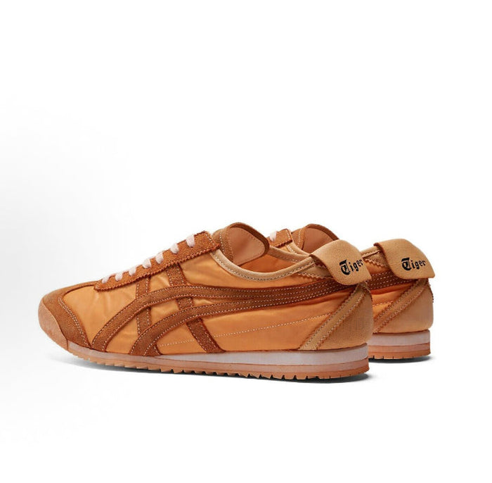 Low-top sneaker, orange-brown suede with diagonal stripes and white sole trim