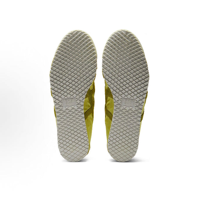 Light chartreuse sneaker outsoles with textured tread and diamond grid pattern