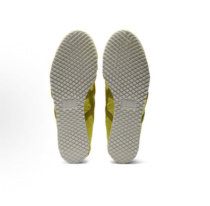 Light chartreuse sneaker outsoles with textured tread and diamond grid pattern