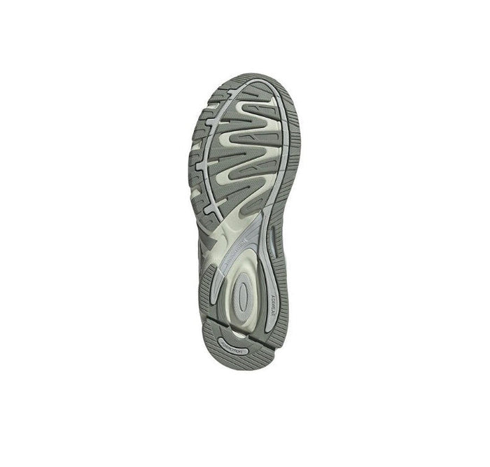 Adidas sneaker outsole, gray tread pattern with circular logo detail.