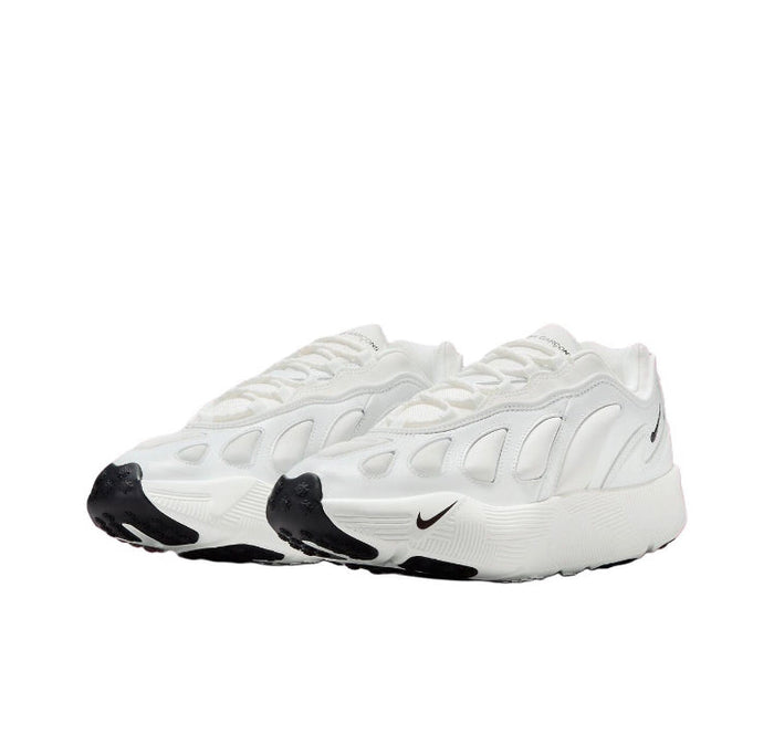 White low-top sneakers with Nike swoosh, stitched panels, and black toe caps