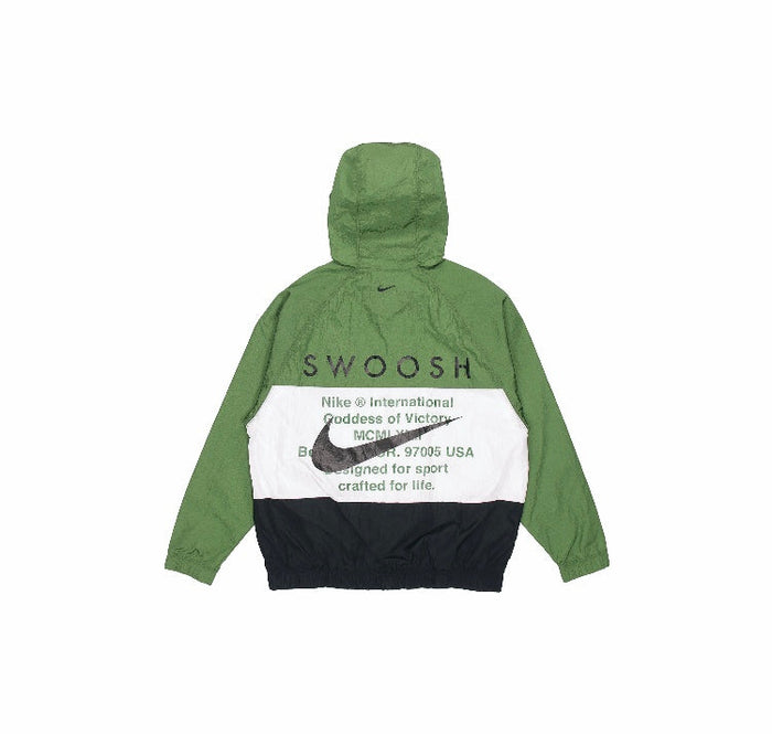 Green and black hooded Nike windbreaker with Swoosh logo and graphic text on back