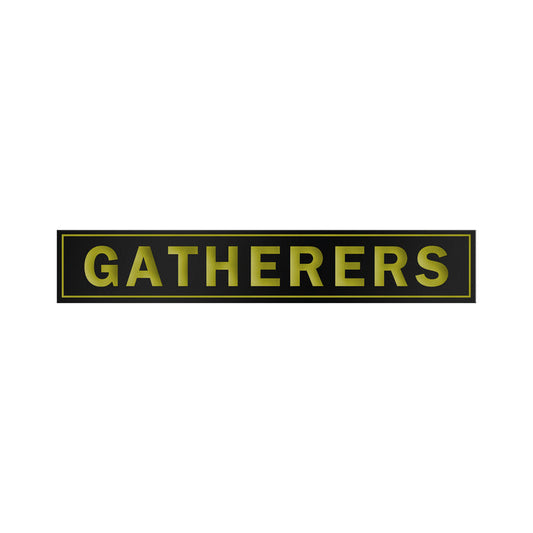 A black rectangular Gatherers sign features bold yellow capital letters, outlined with a thin yellow border, reminiscent of an enamel design, all set against a white background.